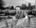 Mungo Martin restoring totem poles